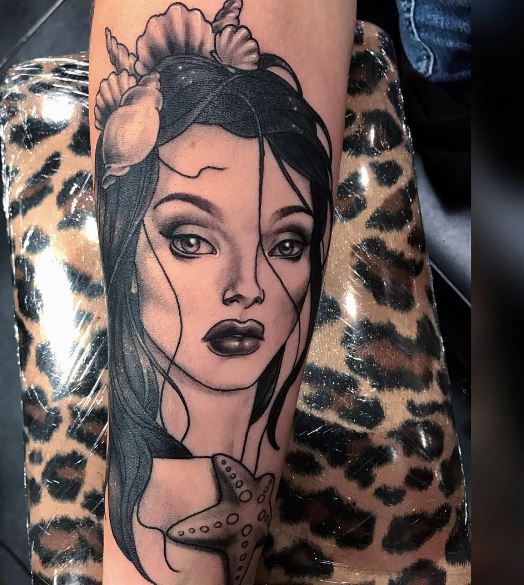 Tatuaje de sirena en el brazo 4