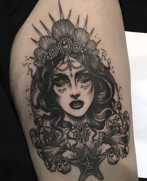 Tatuaje de sirena en el brazo 34