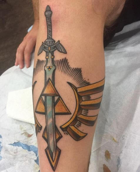 Tatuajes de daga de Zelda en la pierna