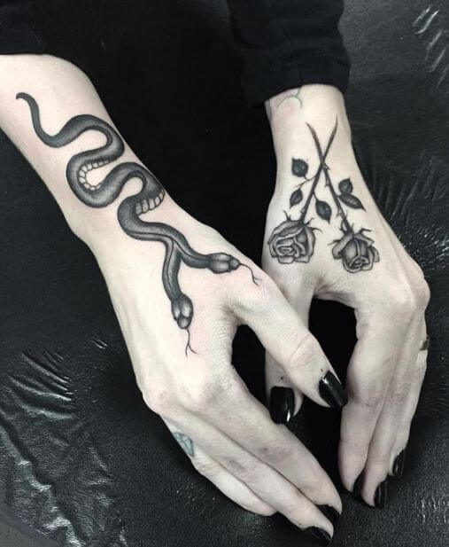 Tatuajes de serpientes de dos caras en el brazo