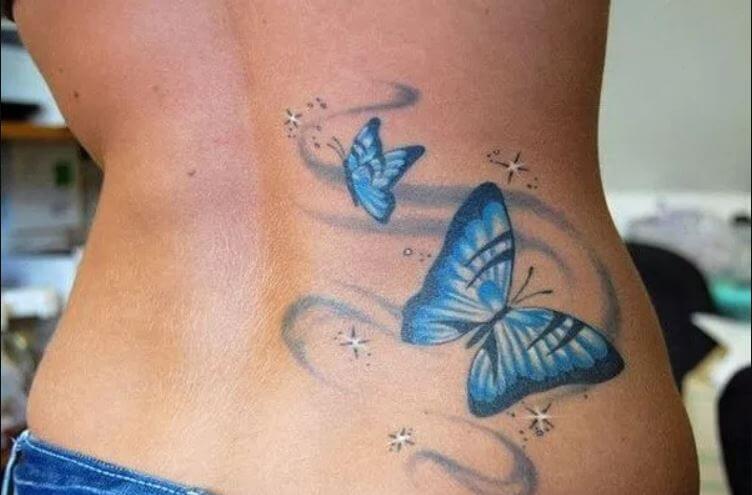 Tatuajes de mariposas en la espalda baja para niñas
