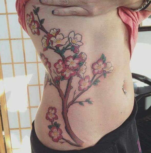 Tatuajes De Costilla De Flor De Cerezo