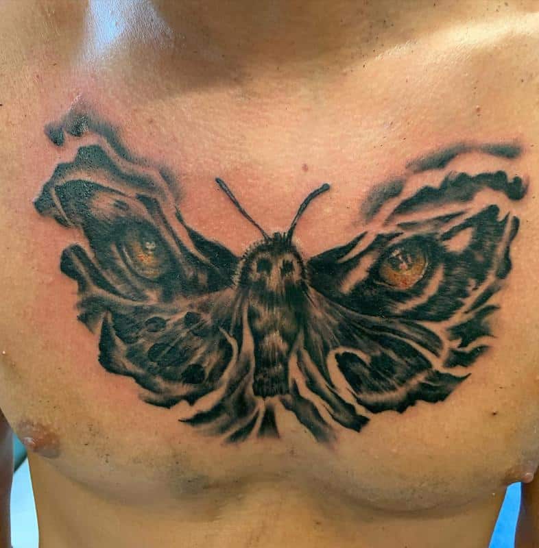 Diseño de tatuaje de ojos de tigre de mariposa