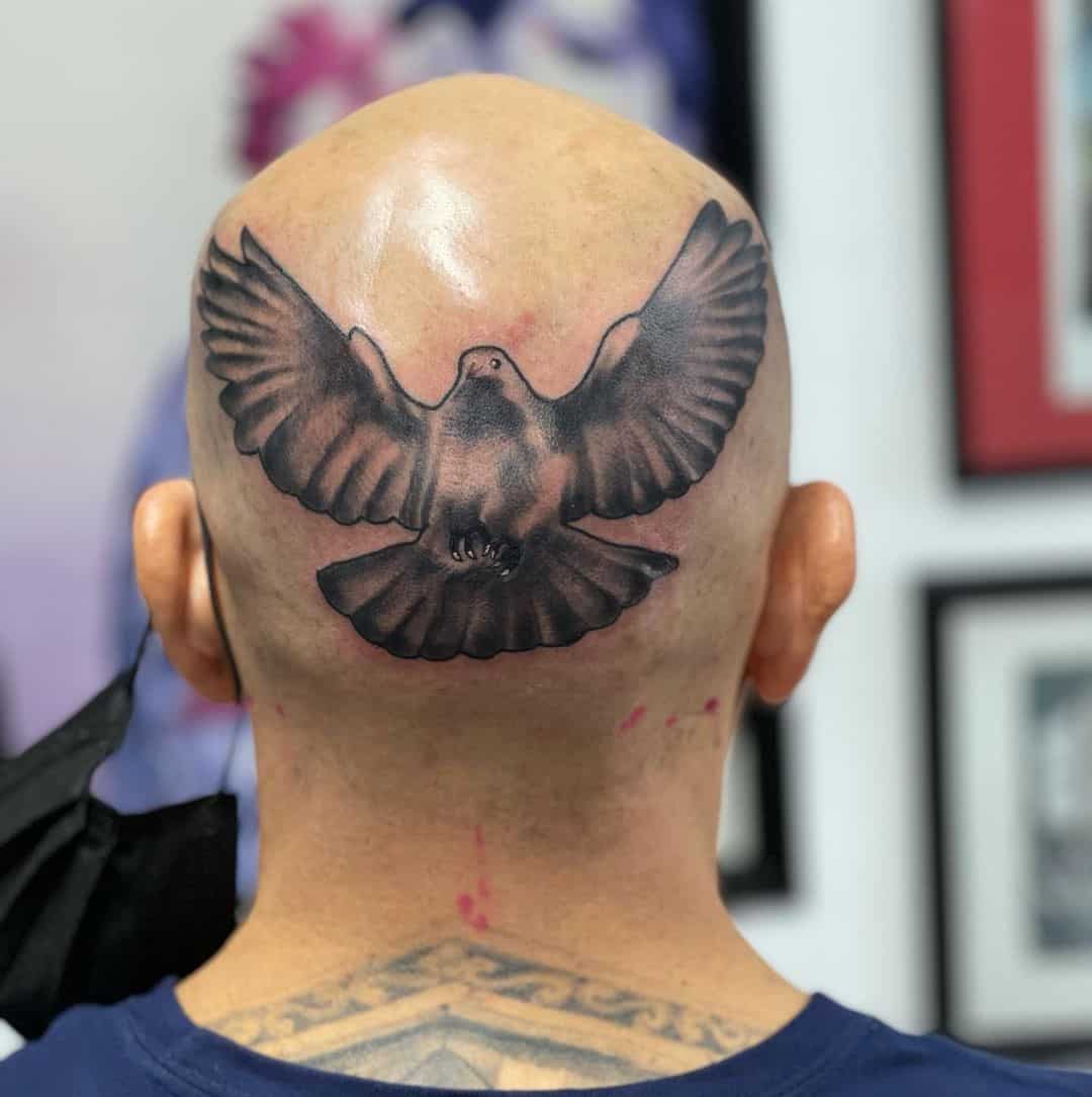 Tatuaje de cabeza de paloma