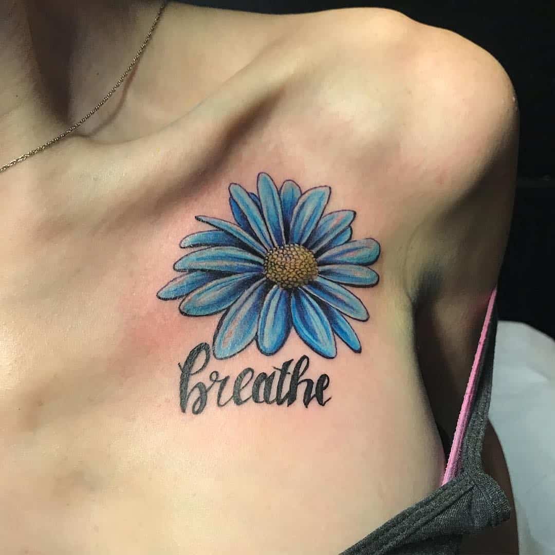 Tatuaje de flor de aster azul 