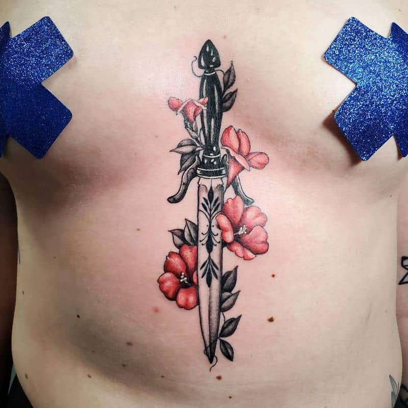 Tatuaje de daga y flor de espinilla colorida 2