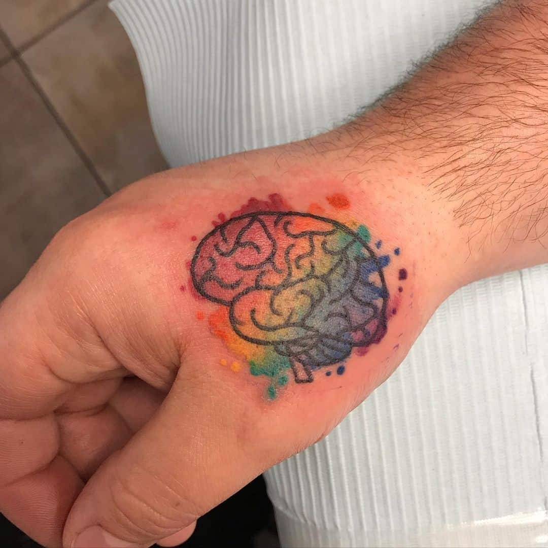 Idea colorida del tatuaje del autismo Brain Inspo 