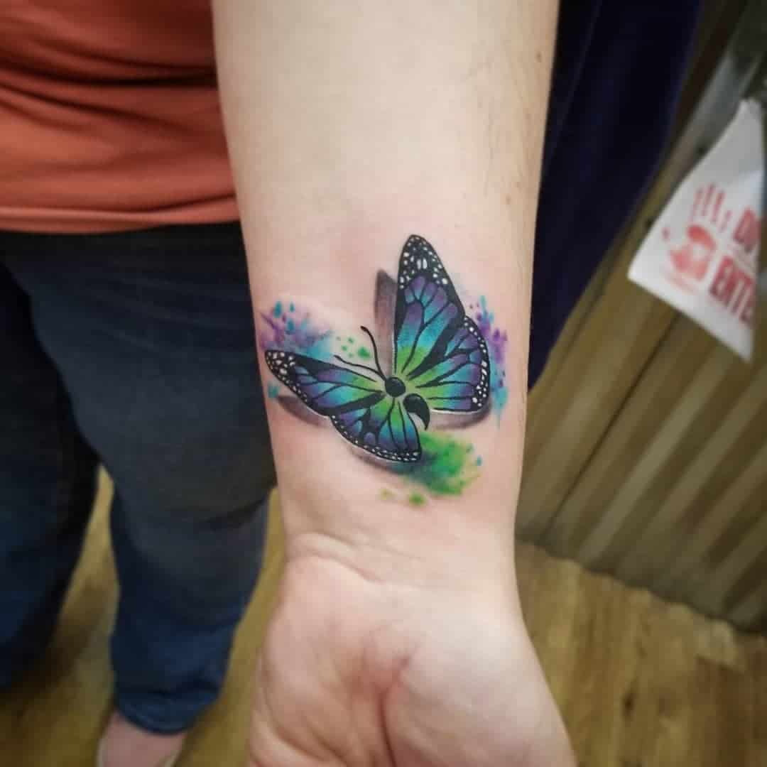 Mariposa punto y coma tatuaje azul arte 
