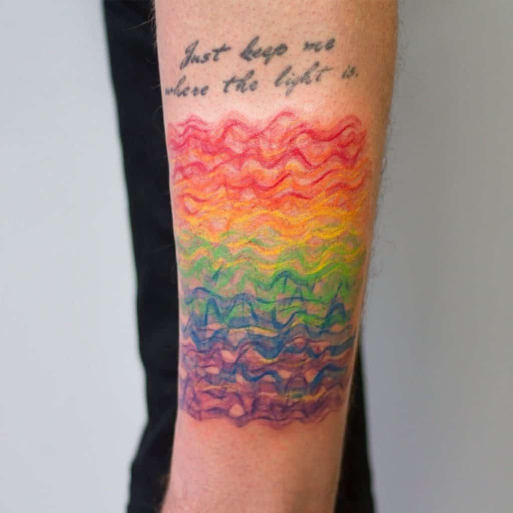 Rainbow Tattoo Ideas Bright Splash sobre el brazo