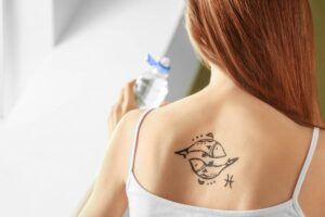 Más de 40 mejores diseños de tatuajes de Piscis y sus significados